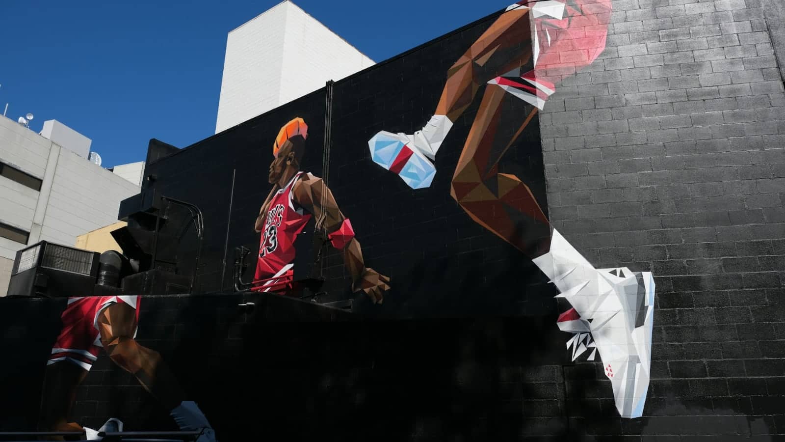 A wall painting of what looks like Michael Jordan used in this article 'Dealing with difficult clients...' that talks about how amateur business people can be in real life.